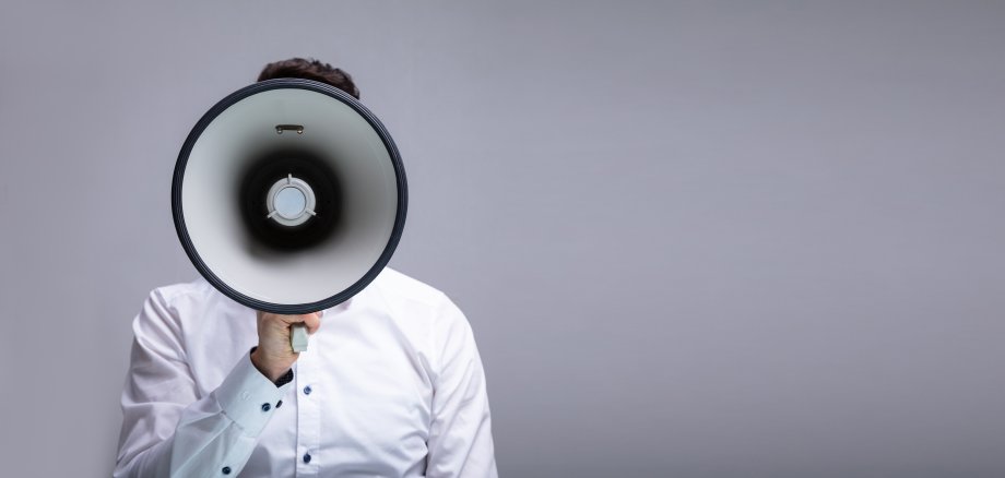Man Doing Announcement On Megaphone