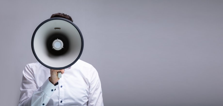 Man Doing Announcement On Megaphone