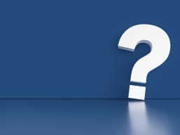 question mark in front of a red color wall background. Business