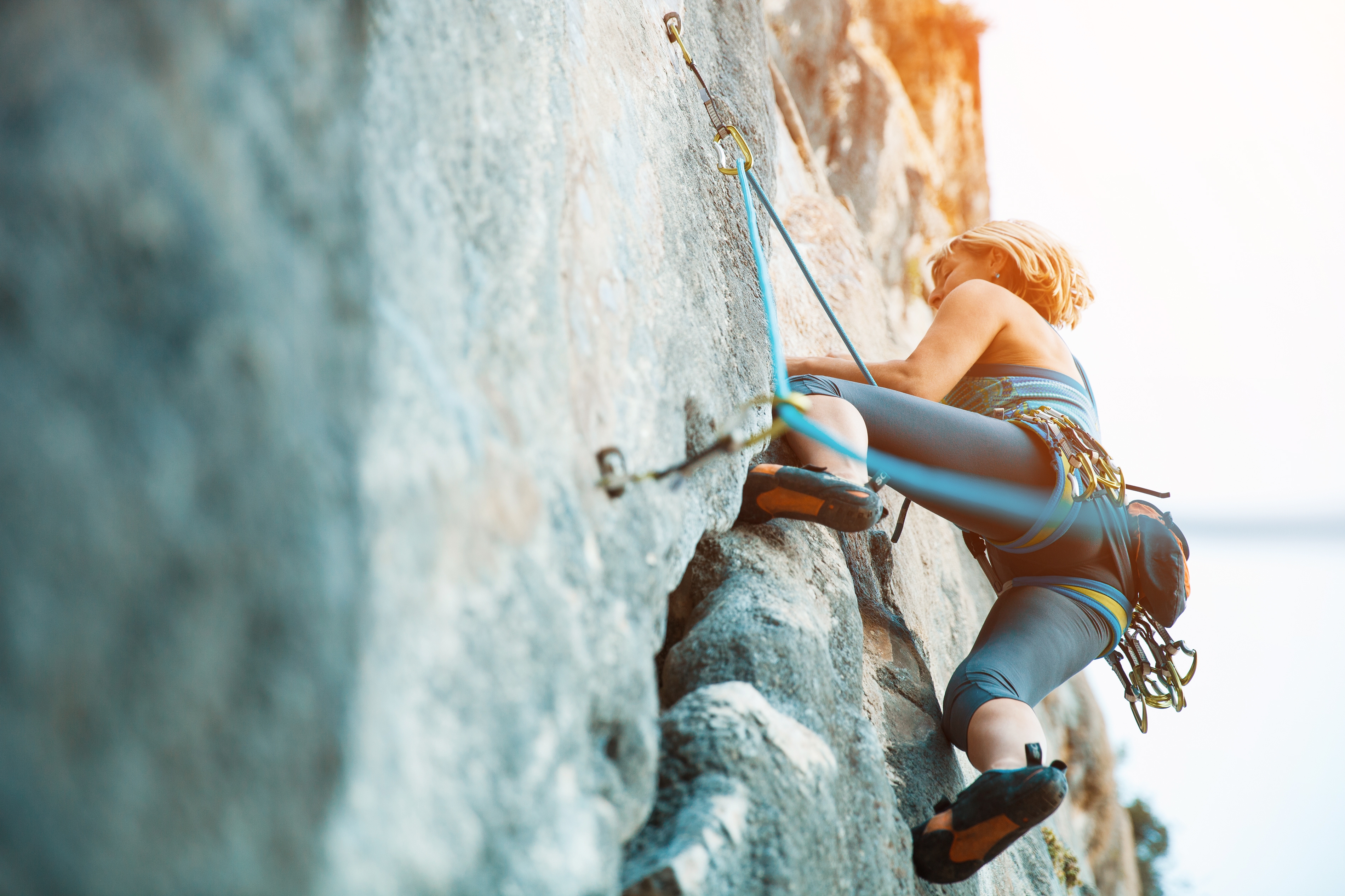 Rock climbing on vertical flat wall - Stock image