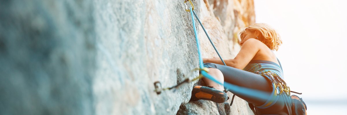Rock climbing on vertical flat wall - Stock image