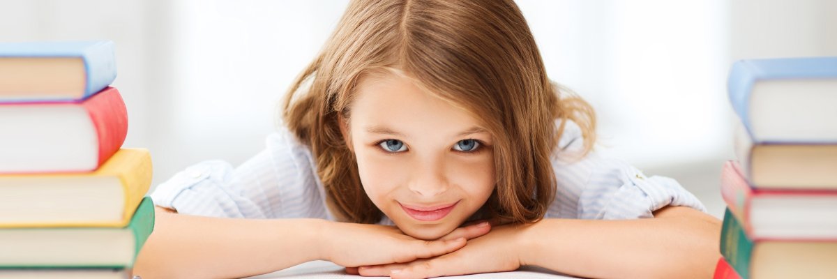 pretty girl with many books at school