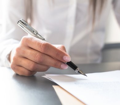 Business woman signing contract, making a deal.