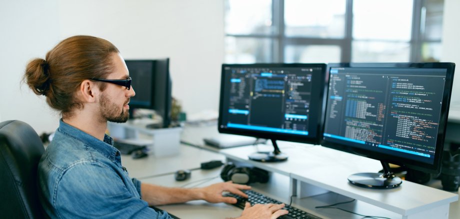 Programming. Man Working On Computer In IT Office