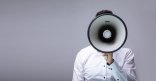 Man Doing Announcement On Megaphone Man Doing Announcement On Megaphone