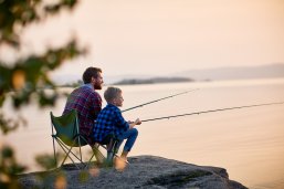 Father and Son Enjoying Fishing Together Father and Son Enjoying Fishing Together