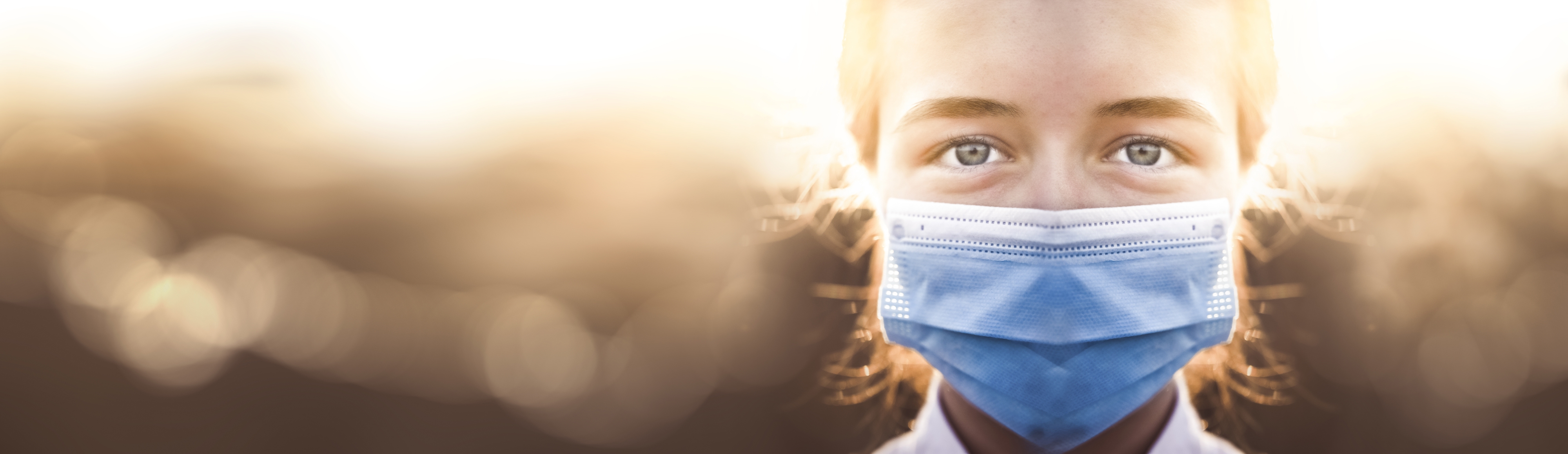 Woman wearing protective mask against coronavirus. Put mask to f