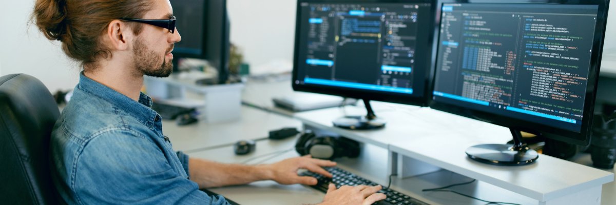Programming. Man Working On Computer In IT Office