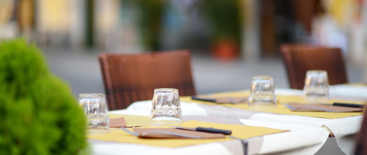 Beautifully decorated small outdoor restaurant tables in the city of Lerici, Italy