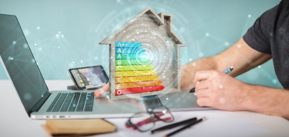 Graphic designer using 3D rendering energy rating chart in a wooden house