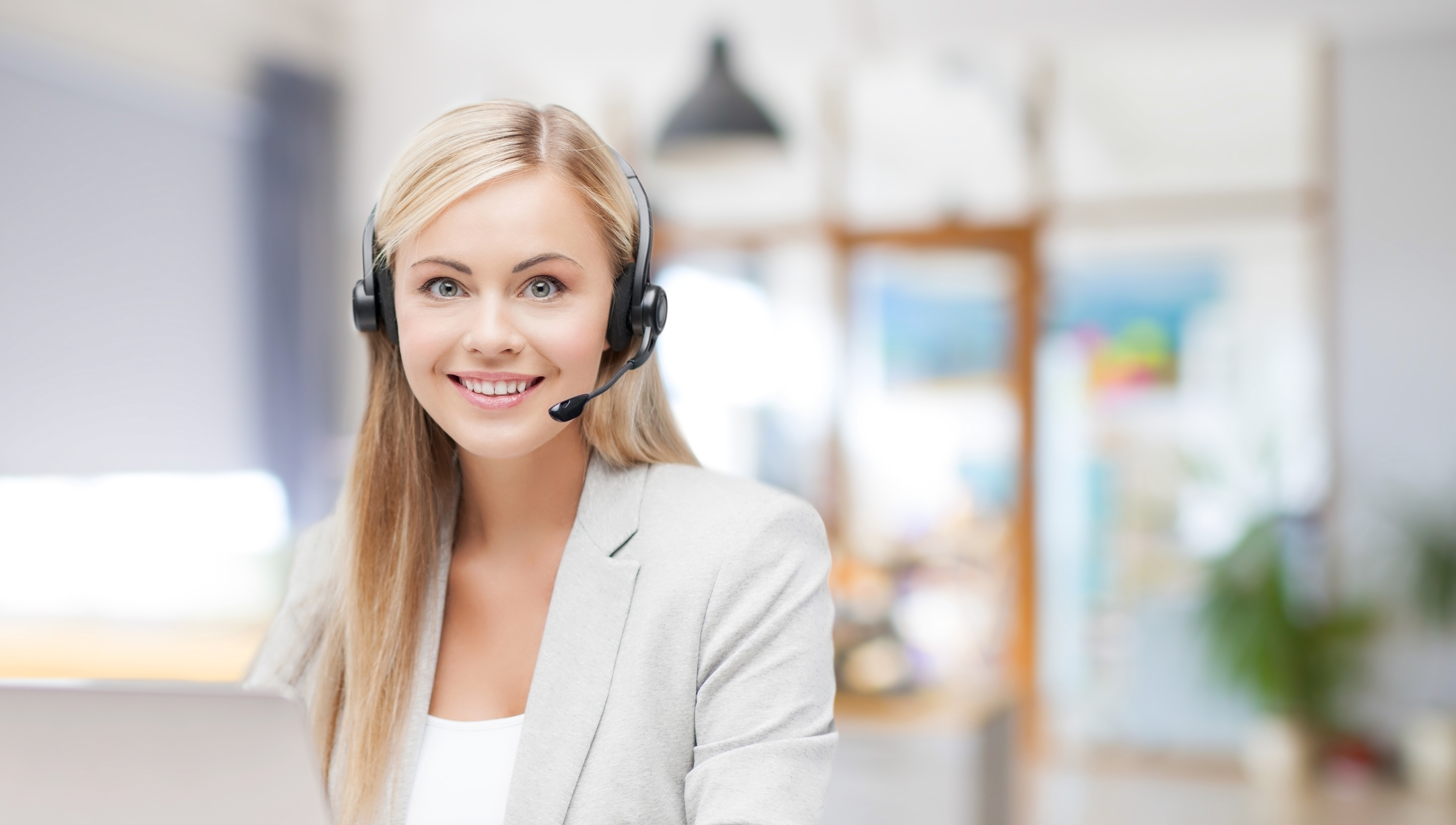 helpline operator in headset working at office