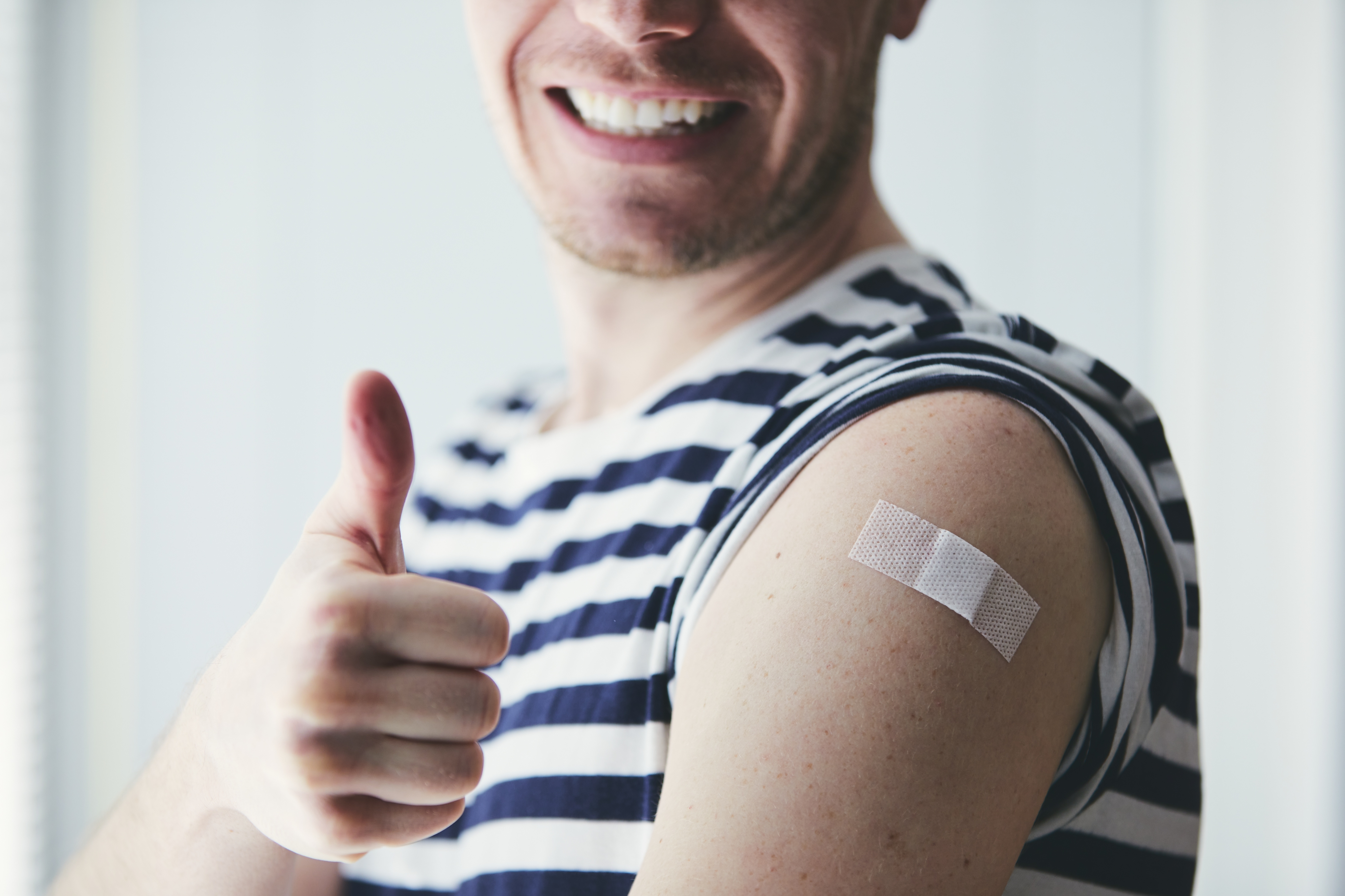 Happy man after vaccination
