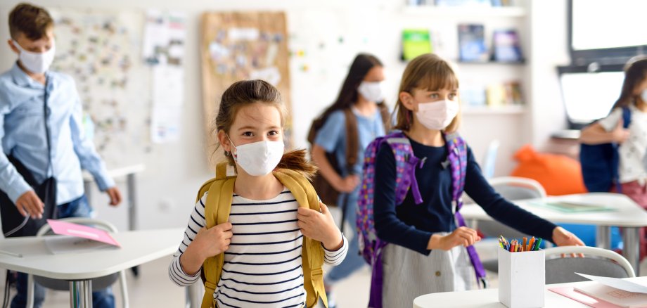 Group of children with face mask back at school after covid-19 quarantine and lockdown. Group of children with face mask back at school after covid-19 quarantine and lockdown.